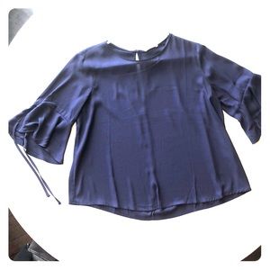 Flowy blue blouse with bell sleeves
